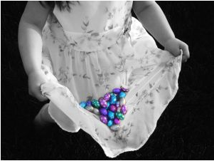 little girl gathering Easter eggs, easter egg hunt photo