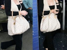 Hillary Duff in designer stuff at the airport.