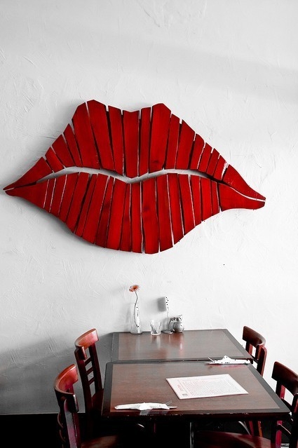 Lip wall art made from reclaimed wood.