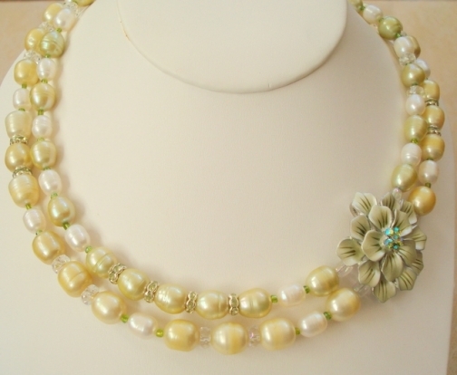 ENAMEL GREEN FLOWER AND PEARLS.