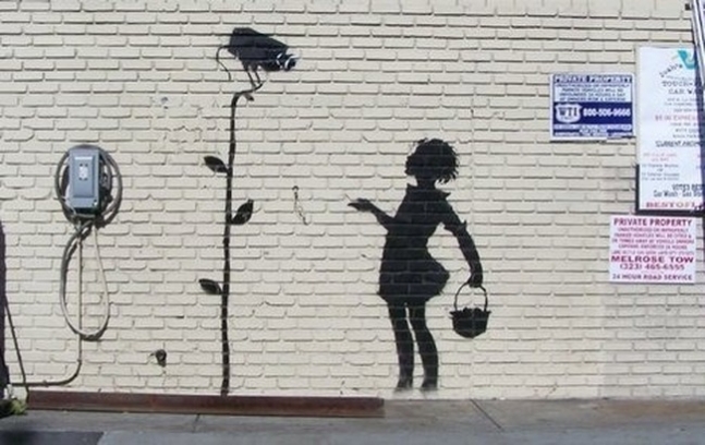 Banksy Los Angeles mural Flower Girl.