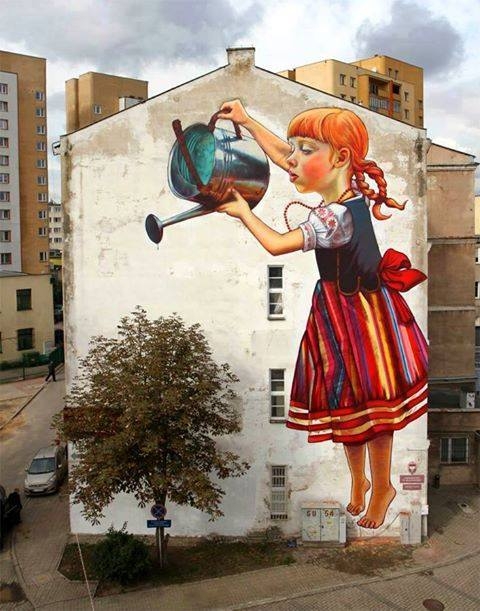 Street art, girl watering tree.