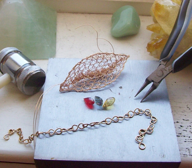 Wire and some gorgeous tiny briolettes in cherry, citrine and blue quartz.