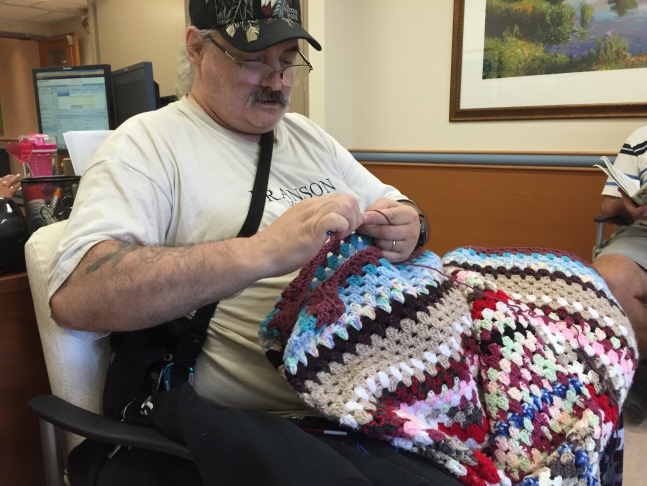 guy crocheting