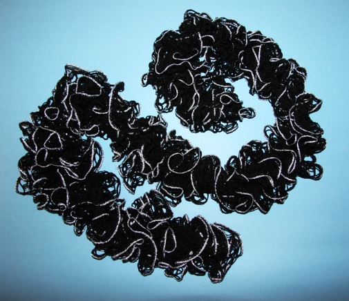 Frilly Black Scarf with light Grey Edges.
